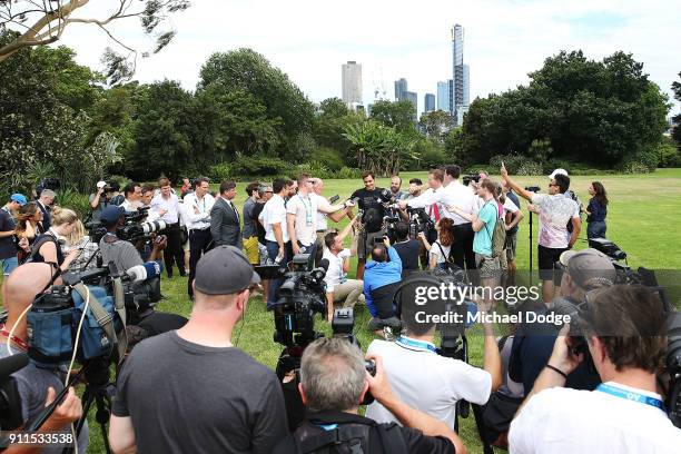 Roger Federer of Switzerland speaks to media with the Norman Brookes Challenge Cup after winning the 2018 Australian Open Men's Singles Final, at...