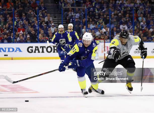 Steven Stamkos of the Tampa Bay Lightning and Alexander Ovechkin of the Washington Capitals fight for the puck during the 2018 Honda NHL All-Star...