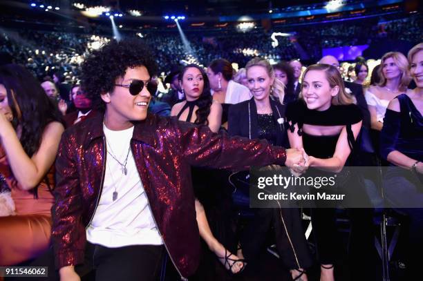Recording artists Bruno Mars and Miley Cyrus attend the 60th Annual GRAMMY Awards at Madison Square Garden on January 28, 2018 in New York City.