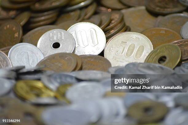 japanese coins - yen sign stock-fotos und bilder