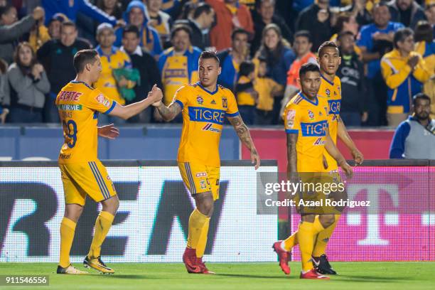 Eduardo Vargas of Tigres celebrates with teammates after scoring his team's first goal during the 4th round match between Tigres UANL and Pachuca as...