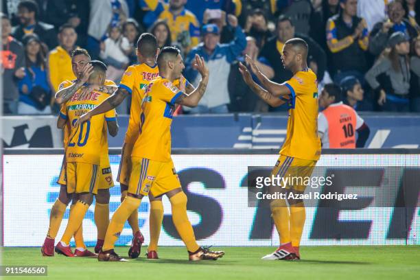 Eduardo Vargas of Tigres celebrates with teammates after scoring his team's first goal during the 4th round match between Tigres UANL and Pachuca as...