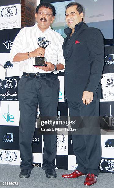 Bollywood director Priyadarshan with Shailendra Singh attend a party in honour of the crew of Kanchivaram in Mumbai on September 23, 2009. The film...