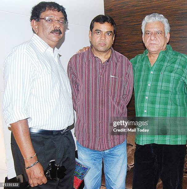 Bollywood director Priyadarshan, actors Paresh Rawal and Ompuri attend a party in honour of the crew of Kanchivaram in Mumbai on September 23, 2009....