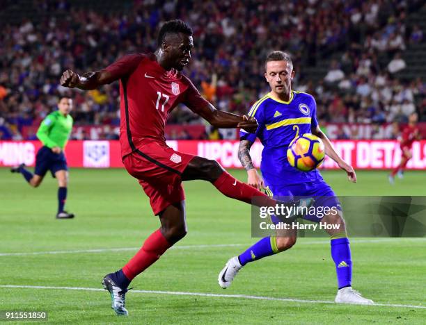 Sapong of The United States attempts a cross in front of Almir Bekic of Bosnia Herzegovina at StubHub Center on January 28, 2018 in Carson,...