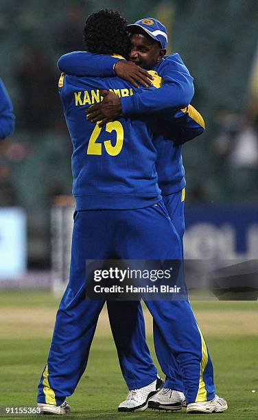 Thilina Kandamby of Sri Lanka is congratulates by team mate Sanath Jayasuriya on his catch to dismiss Andrew Strauss of England during the ICC...