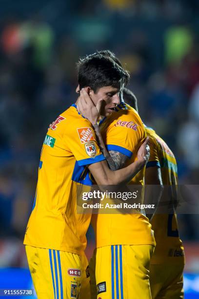 Andre-Pierre Gignac of Tigres celebrates with teammate Jurgen Damm after scoring his team's third goal during the 4th round match between Tigres UANL...