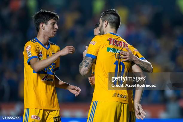 Andre-Pierre Gignac of Tigres celebrates with teammates after scoring his team's third goal during the 4th round match between Tigres UANL and...