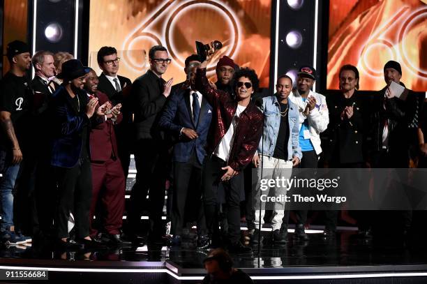 Recording artist Bruno Mars and production team accept the Album Of The Year award for '24K Magic' from recording artists Bono and The Edge of...