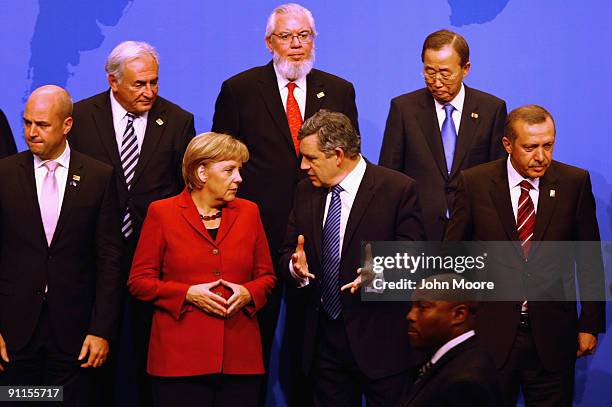 German Chancellor Angela Merkel and British Prime Minister Gordon Brown speak as IMF Managing Director Dominique Strauss-Kahn, Director General of...