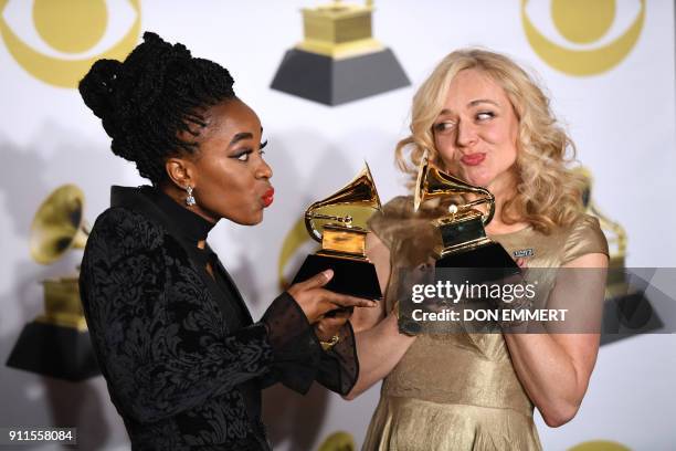 Actors Kristolyn Lloyd and Rachel Bay Jones pose with the Best Musical Theater Album trophy for "Dear Evan Hansen" in the press room during the 60th...