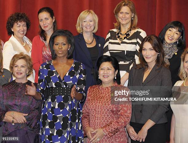 First Lady Michelle Obama speaks during the photo session with G20 spouses including Miyuki Hatoyama , the wife of Japanese Prime Minister Yukio...