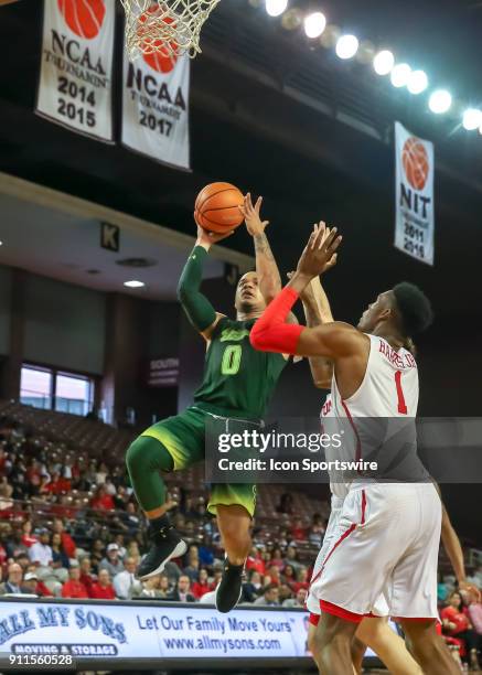 South Florida Bulls guard Stephan Jiggetts leaps for a layup during the college basketball game between the South Florida Bulls and Houston Cougars...