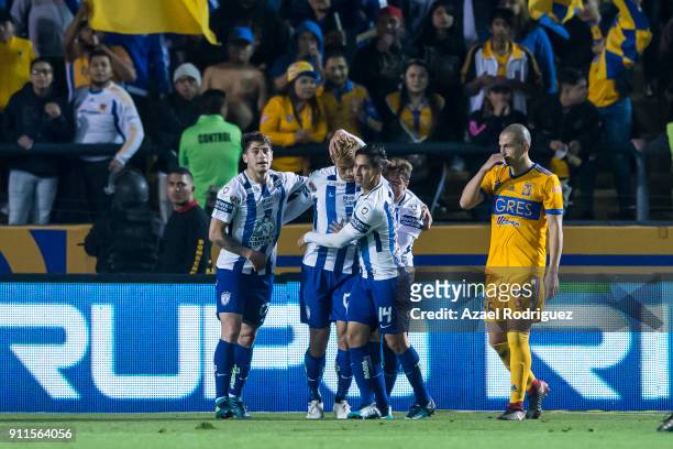 Keisuke Honda of Pachuca celebrates with teammates after scoring his team's second goal during the 4th round match between Tigres UANL and Pachuca as...