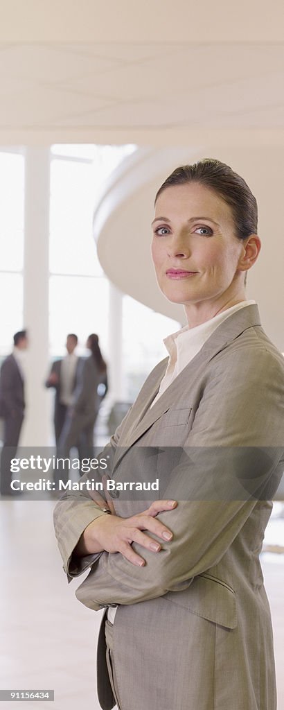 Businesswoman standing in office lobby