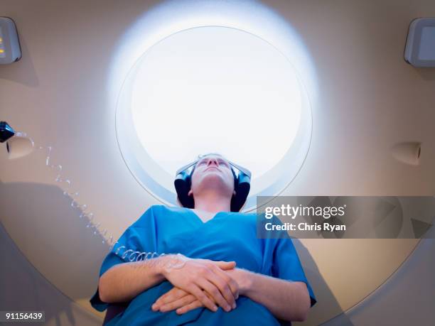 patient about to have mri examination - mri scanner stock pictures, royalty-free photos & images