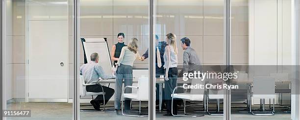 business people meeting in conference room - formelle geschäftskleidung stock-fotos und bilder