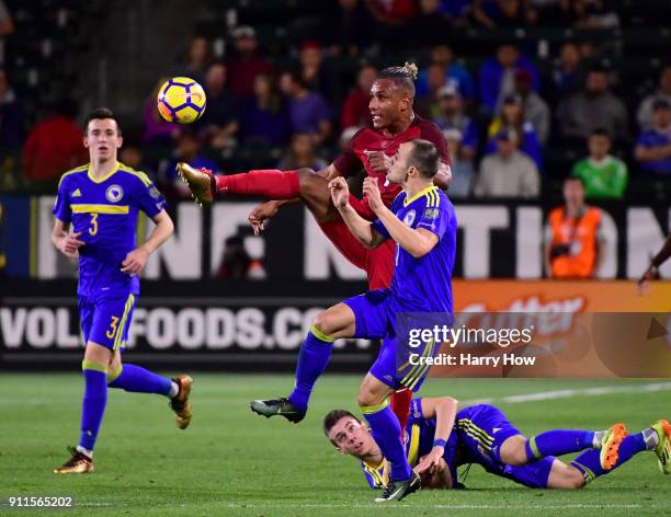 Juan Agudelo of The United States stretches to play the ball from Darko Todorovic of Bosnia Herzegovina at StubHub Center on January 28, 2018 in...