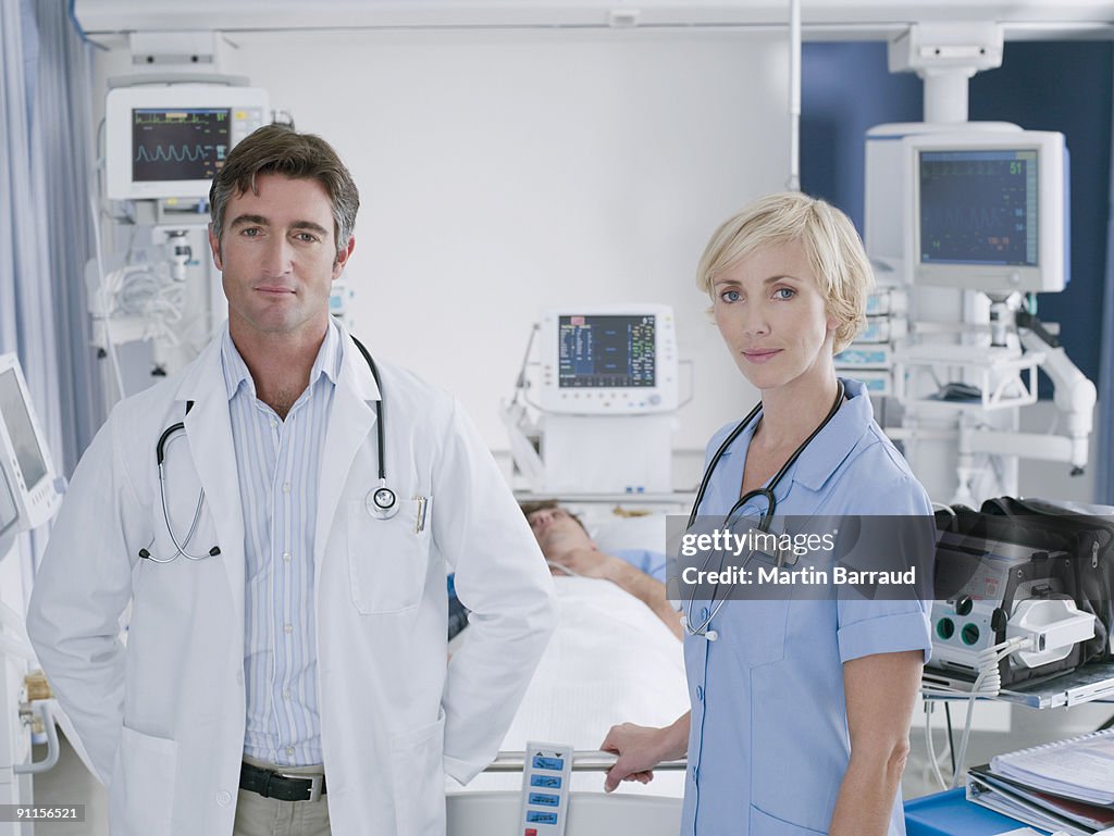 Doctor and nurse standing in intensive care