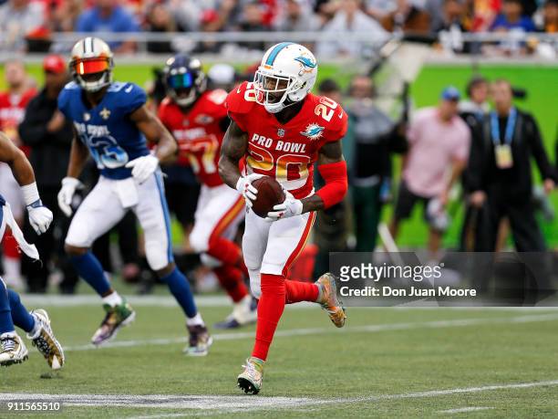 Safety Reshad Jones of the Miami Dolphins from the AFC Team runs back an interception during the NFL Pro Bowl Game at Camping World Stadium on...