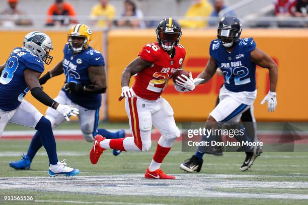 Running back Le'Veon Bell of the Pittsburgh Steelers from the AFC Team avoids being tackled by linebacker Thomas Davis of the Carolina Panthers,...