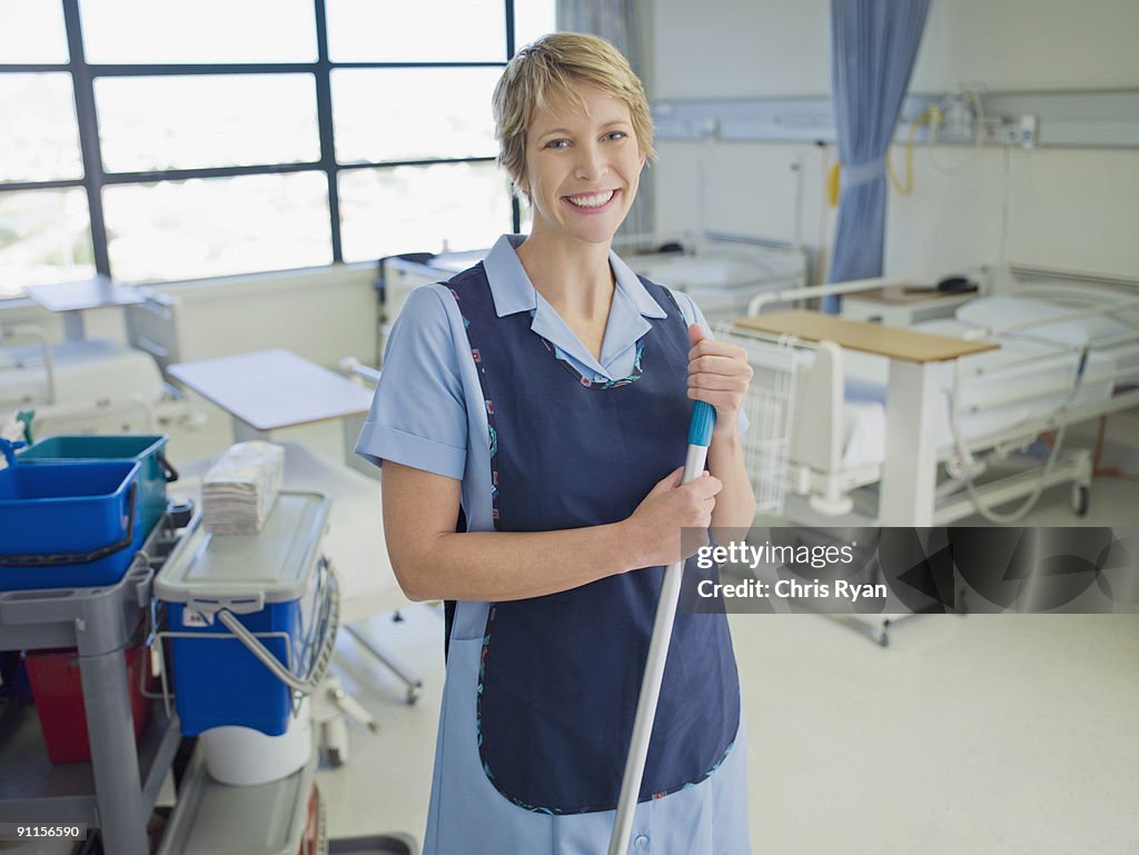 Janitor cleaning hospital room