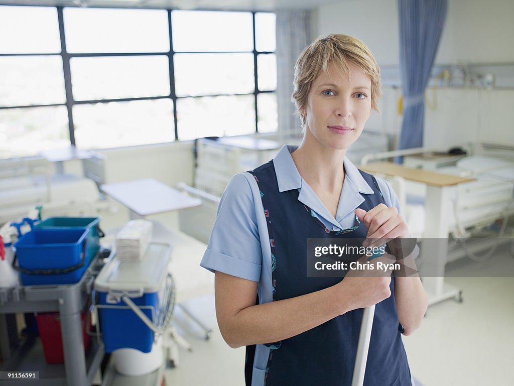 Janitor cleaning hospital room