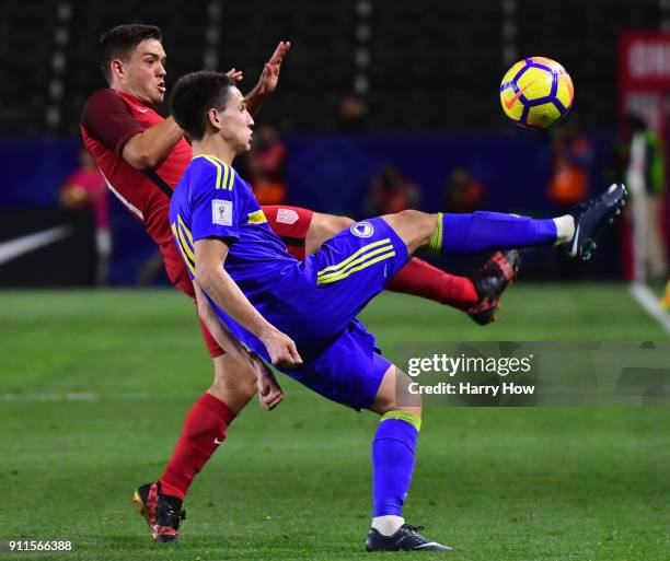 Kelyn Rowe of The United States attempts to block the clear of Luka Menalo of Bosnia Herzegovina during a 0-0 draw at StubHub Center on January 28,...