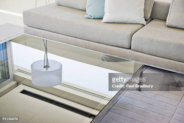 modern living room, sofa and coffee table - coffee table stock pictures, royalty-free photos & images