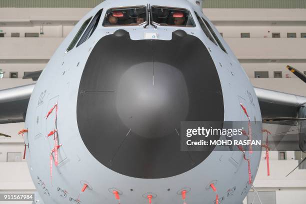 French Defence Minister Florence Parly visits the cockpit of a Royal Malaysian Air Force Airbus A400M military transport plane during the official...