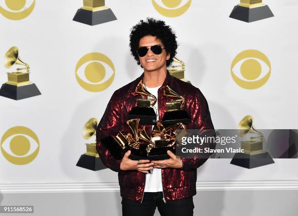Recording artist Bruno Mars winner of, Album of The Year, Song of The Year, Best R and B Album, Best R and B Performance and Record of The Year poses...