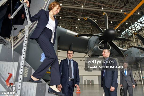 French Defence Minister Florence Parly disembarks from the Royal Malaysian Air Force Airbus A400M military transport plane during an official visit...