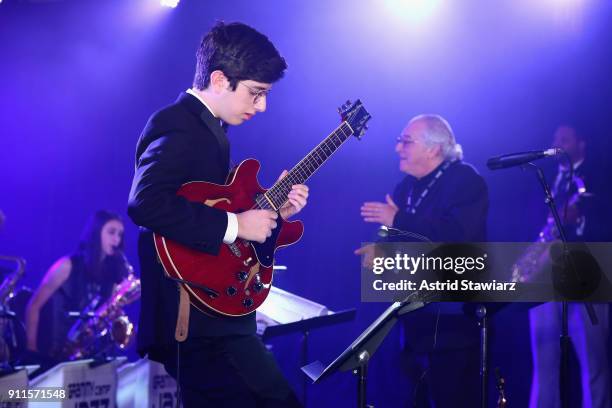 Jazz Education Hall of Fame inductee Justin DiCioccioco conducts GRAMMY Camp®-Jazz Session students as they perform at the 60th Annual GRAMMY Awards...