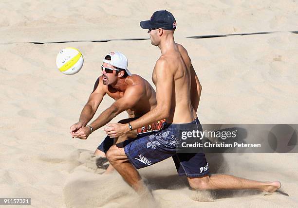 Todd Rogers of USA passes the ball to teammate Phil Dalhausser during the AVP Crocs Tour World Challenge against Brazil at the Westgate City Center...