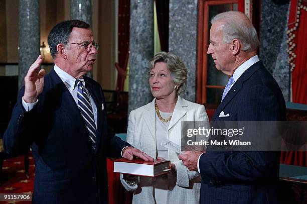 Vice President Joseph Biden swears in Sen. Paul G. Kirk Jr. While his wife Gail Kirk holds a bible during a mock swearing-in ceremony at the US...