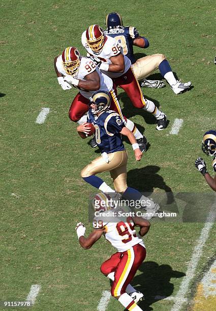 Marc Bulger of the St. Louis Rams carries the ball against the Washington Redskins at FedEx Field on September 20, 2009 in Landover, Maryland.