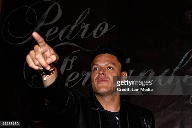 Mexican singer Pedro Fernandez gestures during the press conference to launch the new album 'Amarte a la Antigua' on September 25 in Mexico City,...