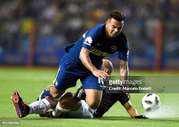 Clemente Rodriguez of Colon fights for the ball with Edwin Cardona of Boca Juniors during a match between Boca Juniors and Colon as part of the...