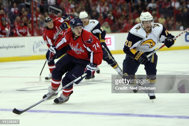 John Carlson of the Washington Capitals handles the puck against the Buffalo Sabres during an NHL preseason hockey game on September 21, 2009 at the...