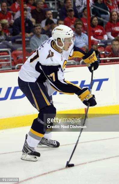 Tyler Myers of the Buffalo Sabres handles the puck against the Washington Capitals during an NHL preseason hockey game on September 21, 2009 at the...