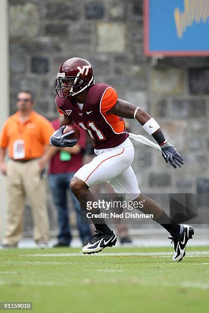 Wide receiver Dyrell Roberts of the Virginia Tech University Hokies runs with the ball against the University of Nebraska Cornhuskers on September...