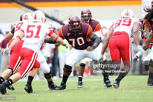 Offensive lineman Sergio Render of the Virginia Tech University Hokies blocks against the University of Nebraska Cornhuskers on September 19, 2009 at...