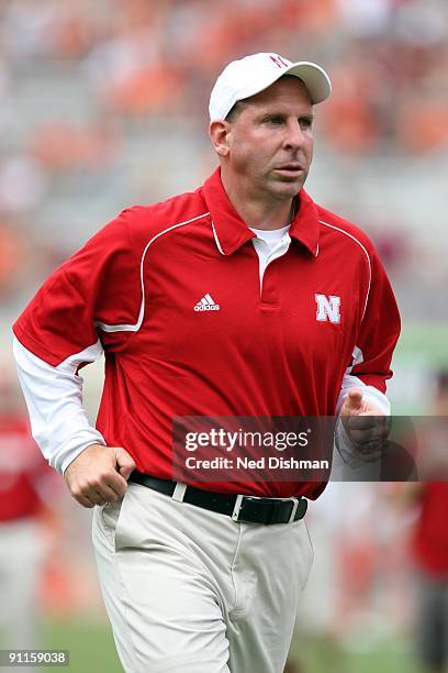 Head coach Bo Pelini of the University of Nebraska Cornhuskers runs on the sideline against the Virginia Tech University Hokies on September 19, 2009...