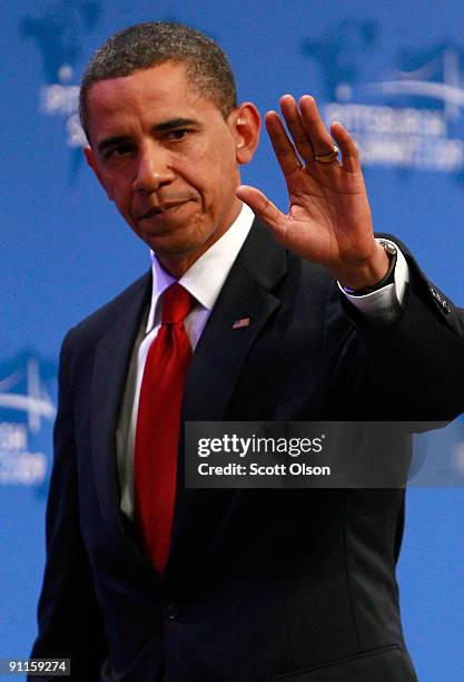 President Barack Obama heads off stage following a news conference at the David Lawrence Convention Center at the end of the G-20 Summit September...