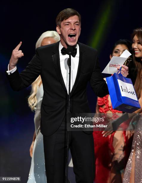 Adult film actor Markus Dupree accepts the award for Male Entertainer of the Year during the 2018 Adult Video News Awards at The Joint inside the...