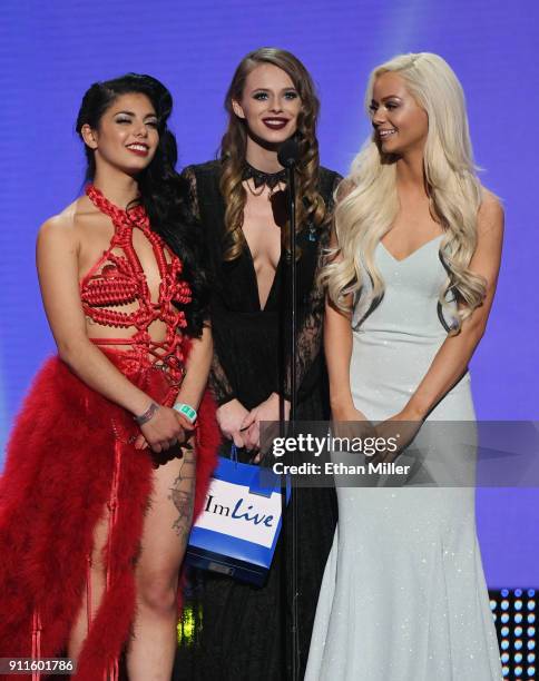 Adult film actresses Gina Valentina, Jillian Janson and Elsa Jean present an award during the 2018 Adult Video News Awards at The Joint inside the...