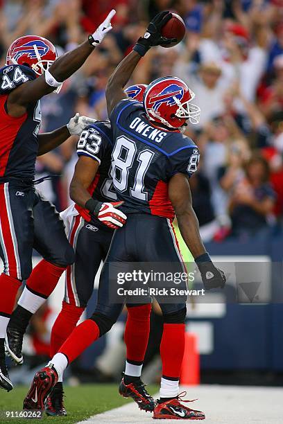 Wide receiver Terrell Owens of the Buffalo Bills celebrates with teammates Xavier Omon and Lee Evans during the game against the Tampa Bay Buccaneers...