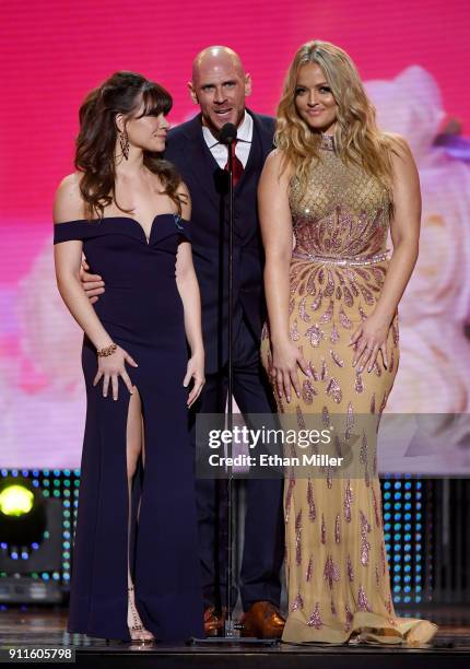 Adult film actress Alison Rey, adult film actor Johnny Sins and adult film actress/director Alexis Texas present an award during the 2018 Adult Video...