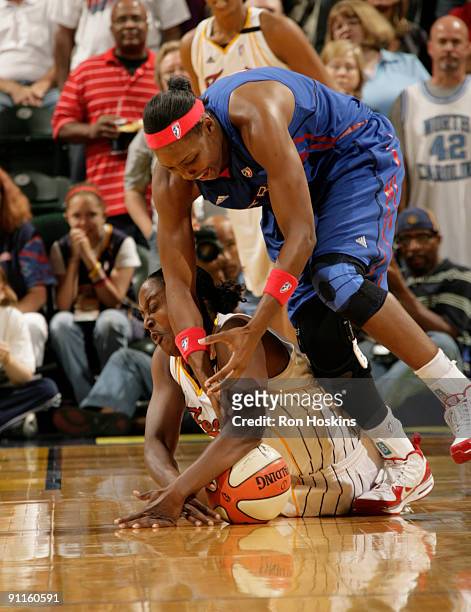 Ebony Hoffman of the Indiana Fever battles Cheryl Ford of the Detroit Shock during Game Two of the Eastern Conference Finals at Conseco Fieldhouse on...