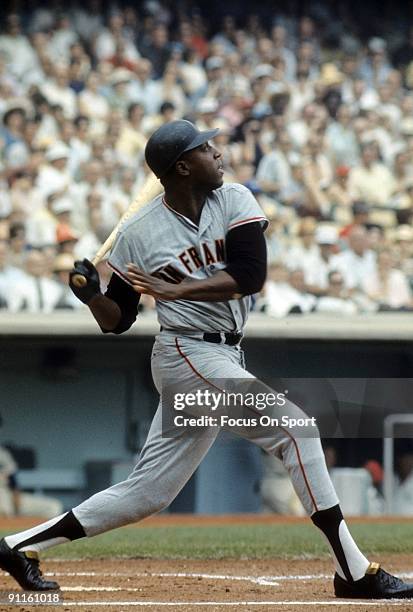 S: first baseman Willie McCovey of the San Francisco Giants swings and watches the flight of his ball during a circa mid 1960's Major League Baseball...